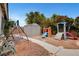 Backyard features storage shed, swing, and slide at 5220 Shasta Daisy St, North Las Vegas, NV 89031