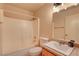 Well-lit bathroom with a tub and shower combination, a stylish vanity, and modern fixtures at 5220 Shasta Daisy St, North Las Vegas, NV 89031
