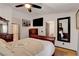 Spacious bedroom features an ensuite bathroom and a large mirror adding depth to the room at 5220 Shasta Daisy St, North Las Vegas, NV 89031