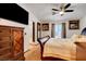 Comfortable bedroom with elegant furnishings, a large TV, and an attached bathroom for added convenience at 5220 Shasta Daisy St, North Las Vegas, NV 89031
