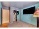 Stylish bedroom with a TV, closet with sliding doors, and soft carpeting for a cozy feel at 5220 Shasta Daisy St, North Las Vegas, NV 89031