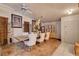 A dining room with wooden flooring, vintage decor and an inviting ambiance at 5220 Shasta Daisy St, North Las Vegas, NV 89031