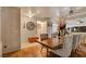 A dining room with hardwood flooring, and vintage decor elements at 5220 Shasta Daisy St, North Las Vegas, NV 89031