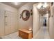 Bright home entry foyer featuring tile floors, stylish mirror and lighting fixtures at 5220 Shasta Daisy St, North Las Vegas, NV 89031