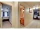 Inviting hallway featuring tile flooring, leading to a bedroom and bathroom with natural light at 5220 Shasta Daisy St, North Las Vegas, NV 89031