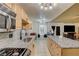 Open kitchen featuring granite countertops, stainless steel appliances, and backyard access at 5220 Shasta Daisy St, North Las Vegas, NV 89031