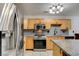 Updated kitchen includes granite countertops, stainless steel appliances, and island seating at 5220 Shasta Daisy St, North Las Vegas, NV 89031