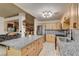Bright kitchen featuring granite countertops, stainless steel appliances, and ample cabinet space at 5220 Shasta Daisy St, North Las Vegas, NV 89031