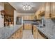 Well-lit kitchen showcases granite countertops, modern fixtures, and abundant cabinet storage at 5220 Shasta Daisy St, North Las Vegas, NV 89031