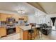 Inviting kitchen with granite countertops, island seating, and stainless steel appliances at 5220 Shasta Daisy St, North Las Vegas, NV 89031