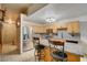 Modern kitchen features stainless steel appliances, granite countertops, and an island at 5220 Shasta Daisy St, North Las Vegas, NV 89031