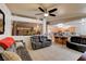 Open-concept living room with tile floors, modern furniture and lots of light at 5220 Shasta Daisy St, North Las Vegas, NV 89031