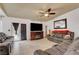 Comfortable living room with tile floors, cozy seating and access to the outdoors at 5220 Shasta Daisy St, North Las Vegas, NV 89031
