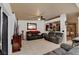 Inviting living room featuring neutral colors, tile flooring and an open floor plan at 5220 Shasta Daisy St, North Las Vegas, NV 89031