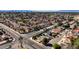 A scenic view of a neighborhood, showcasing houses and landscaping with a city skyline in the distance at 5274 Somerset Dr, Las Vegas, NV 89120