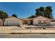 Charming single-story home with desert landscaping and a two-car garage on a sunny day at 5274 Somerset Dr, Las Vegas, NV 89120