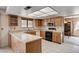 Functional kitchen equipped with a microwave, oven, and ample cabinet space for storage at 5274 Somerset Dr, Las Vegas, NV 89120