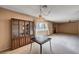 A spacious living room featuring a fireplace, ceiling fan and vintage furnishings at 5274 Somerset Dr, Las Vegas, NV 89120