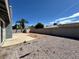 Spacious backyard featuring a concrete patio, gravel landscaping, and a storage shed near the block fence at 5460 Conville Pl, Las Vegas, NV 89120