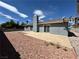 Backyard features a concrete patio area with low maintenance desert landscaping at 5460 Conville Pl, Las Vegas, NV 89120