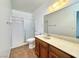 Bathroom with walk-in shower, single sink vanity, and neutral color palette at 5460 Conville Pl, Las Vegas, NV 89120