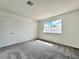 Bedroom with plush carpeting, neutral color palette, and natural light at 5460 Conville Pl, Las Vegas, NV 89120