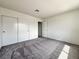 Bedroom with plush carpeting, wide closet, and neutral color palette at 5460 Conville Pl, Las Vegas, NV 89120