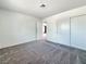 Bedroom with plush carpeting, neutral color palette, and wide closet at 5460 Conville Pl, Las Vegas, NV 89120