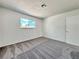 Bedroom with plush carpeting, neutral color palette, and natural light at 5460 Conville Pl, Las Vegas, NV 89120