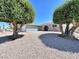 Charming single-story home featuring mature landscaping and a unique gravel front yard at 5460 Conville Pl, Las Vegas, NV 89120