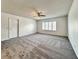 Open living room featuring neutral walls, plush carpet and bright window bringing in plenty of sunlight at 5460 Conville Pl, Las Vegas, NV 89120