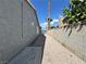 View of the side yard with block fencing and decorative rock landscaping at 5460 Conville Pl, Las Vegas, NV 89120