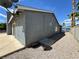 View of the side yard of the home with gravel landscaping and access to the backyard at 5460 Conville Pl, Las Vegas, NV 89120