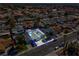 An aerial view highlights a charming home with a private backyard pool, surrounded by palm trees and lush greenery at 6181 Cedarwood Ave, Las Vegas, NV 89103