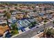 Aerial view showcases a charming home with a private backyard pool, palm trees, and a detached garage at 6181 Cedarwood Ave, Las Vegas, NV 89103