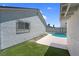 Synthetic grass and view of the pool at 6181 Cedarwood Ave, Las Vegas, NV 89103