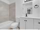 Updated bathroom with a tiled shower, modern fixtures, and a sleek white vanity at 6181 Cedarwood Ave, Las Vegas, NV 89103