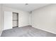 Carpeted bedroom featuring closet with sliding doors, and gray walls at 6181 Cedarwood Ave, Las Vegas, NV 89103