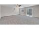 Spacious bedroom with neutral carpet, ceiling fan, and sliding glass doors to the pool at 6181 Cedarwood Ave, Las Vegas, NV 89103