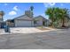 Well-maintained single-story home with an attached garage, neat landscaping, and inviting curb appeal at 6181 Cedarwood Ave, Las Vegas, NV 89103