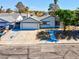 Beautiful single-story home boasts a well-kept lawn, attached garage, and an inviting presence at 6181 Cedarwood Ave, Las Vegas, NV 89103