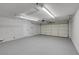 Spacious garage with an insulated garage door, smooth floors, and lighting at 6181 Cedarwood Ave, Las Vegas, NV 89103