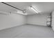 Clean, spacious garage featuring a water heater and a garage door opener at 6181 Cedarwood Ave, Las Vegas, NV 89103