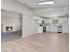 Inviting open-concept kitchen featuring white cabinets, stainless steel appliances, and access to the living room at 6181 Cedarwood Ave, Las Vegas, NV 89103