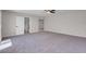 Large main bedroom with ensuite bathroom, neutral carpet, and bright natural light at 6181 Cedarwood Ave, Las Vegas, NV 89103