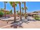 Resort-style backyard featuring a custom rock waterfall, pool, spa, and covered outdoor kitchen at 6224 Red Pine Ct, Las Vegas, NV 89130
