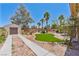 Expansive backyard with lush green grass, mature landscaping, and a storage shed at 6224 Red Pine Ct, Las Vegas, NV 89130