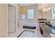 Bright bathroom featuring a shower, soaking tub with black accents, and marble flooring at 6224 Red Pine Ct, Las Vegas, NV 89130