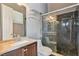 Modern bathroom with dark tiled shower, chrome fixtures, and a white vanity at 6224 Red Pine Ct, Las Vegas, NV 89130