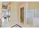Hallway leading to bright bathroom with standalone shower at 6224 Red Pine Ct, Las Vegas, NV 89130